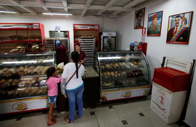 People buy bread at a state-run bakery in Caracas, Venezuela, June 25, 2016. (Photo by Marco Bello/Reuters)