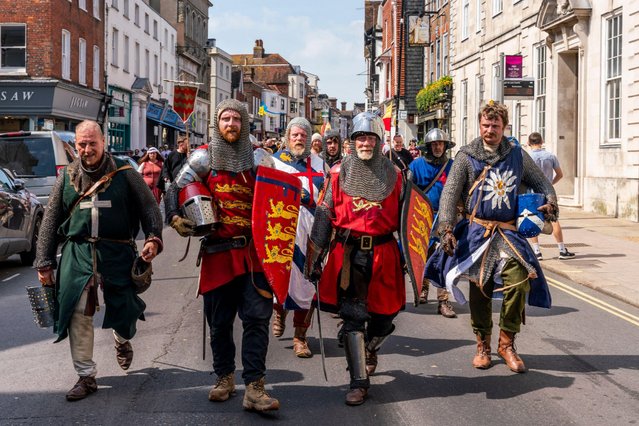 Locals dressed in medieval costumes take part on May 11, 2024 in a procession through Lewes, East Sussex, marking the anniversary of the battle of Lewes on May 14, 1264. The battle took place between the armies of Henry III and Simon de Montfort. Despite inferior numbers, de Montfort’s forces triumphed. (Photo by Grant Rooney/Alamy News)