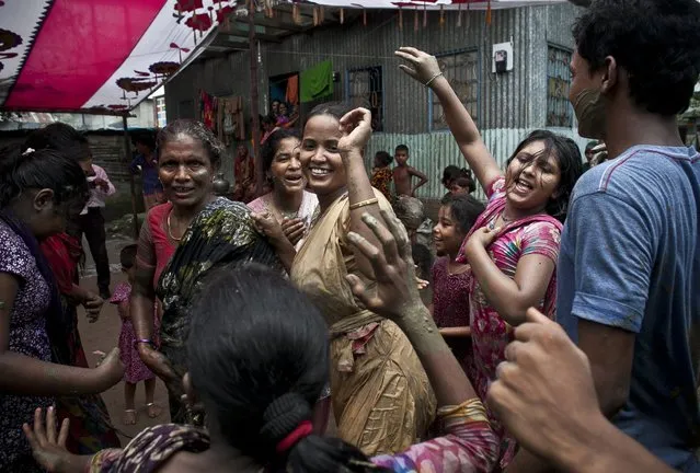 Wedding guests dance and celebrate on the day of the wedding of 15-year-old Nasoin Akhter to a 32-year-old man, August 20, 2015, in Manikganj, Bangladesh. (Photo by Allison Joyce/Getty Images)