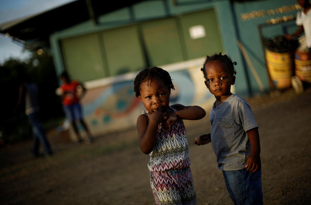 Two African migrant children stand at a temporary shelter in the La Cruz, Costa Rica, July 14, 2016. (Photo by Juan Carlos Ulate/Reuters)