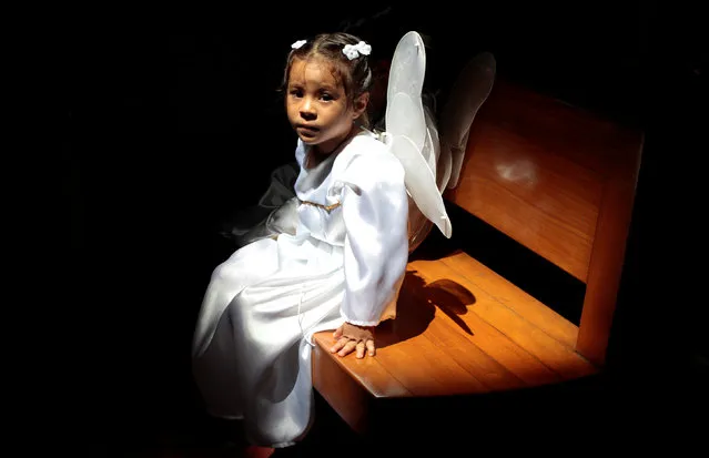 A girl dressed as an angel takes part in a procession of “Sangre de Cristo” at the Metropolitan Cathedral in Managua, Nicaragua  July 3, 2016. (Photo by Oswaldo Rivas/Reuters)