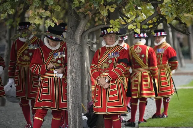 The Yeomen Warders of His Majesty's Royal Palace and Fortress of the Tower of London, commonly known as Beefeaters, take a break in Westminster Hall Gardens on September 15, 2022 in London, England. Queen Elizabeth II is lying in state at Westminster Hall until the morning of her funeral to allow members of the public to pay their last respects. Elizabeth Alexandra Mary Windsor was born in Bruton Street, Mayfair, London on 21 April 1926. She married Prince Philip in 1947 and acceded to the throne of the United Kingdom and Commonwealth on 6 February 1952 after the death of her Father, King George VI. Queen Elizabeth II died at Balmoral Castle in Scotland on September 8, 2022, and is succeeded by her eldest son, King Charles III (Photo by Christopher Furlong/Getty Images)