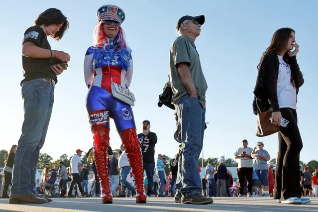 Micki Larson-Olson waits in costume with fellow Trump supporters to rally with former U.S. President Donald Trump at Wilmington International Airport in Wilmington, North Carolina, U.S. September 23, 2022. (Photo by Jonathan Ernst/Reuters)