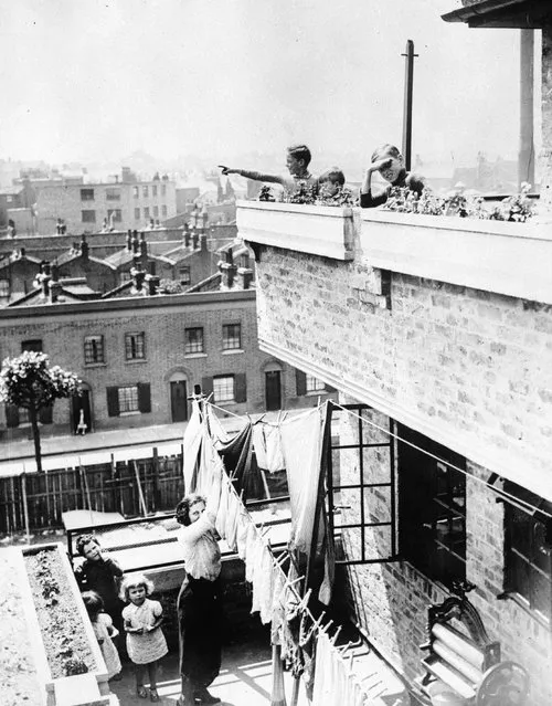 Bethnal Green and East London Housing Association flats at Brunswick Street, Hackney, July 1936. Deep balconies are set back from those of the floor below forming a terraced pyramidical shape. Permanent flower boxes are also included in the design. (Photo by Fox Photos)
