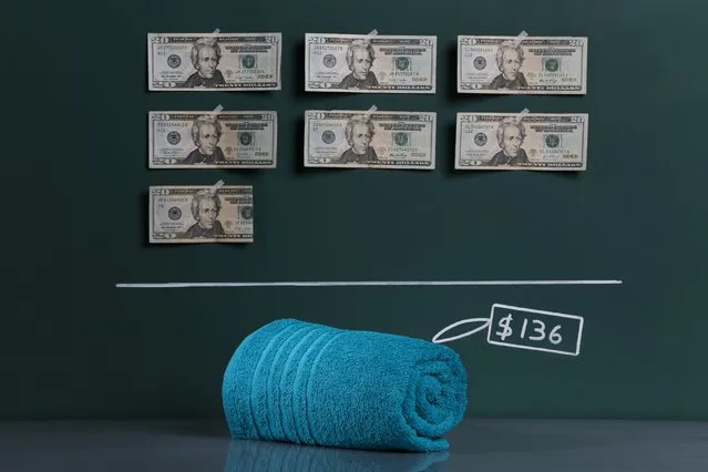 A locally produced bath towel as photographed in a studio with an illustrative price tag of $136 (US dollars), equivalent to the Bs. 859 (bolivars) that it costs on average to purchase in Caracas at the official exchange rate of 6.3 bolivars per dollar, in Caracas September 29, 2014. (Photo by Carlos Garcia Rawlins/Reuters)