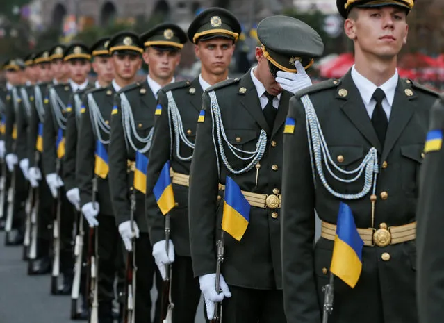 Ukrainian servicemen stand in formation during a rehearsal for the Independence Day military parade in central Kiev, Ukraine, August 22, 2016. (Photo by Valentyn Ogirenko/Reuters)