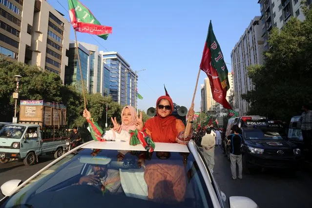 Supporters of former Prime Minister Imran Khan's political party Pakistan Tehrik-e-Insaf  during a rally as Khan announced a protest march to Islamabad, in Karachi, Pakistan, 28 October 2022. Pakistan's former Prime Minister Imran Khan on 28 October, leads a march from the city of Lahore to the capital Islamabad seeking 'real freedom', after his term came to an abrupt end earlier this year on losing a no confidence motion in the parliament.The former premier blamed the US for supporting the opposition parties led by incumbent Prime Minister Shehbaz Sharif's Pakistan Muslim League (Nawaz). (Photo by Rehan Khan/EPA/EFE)