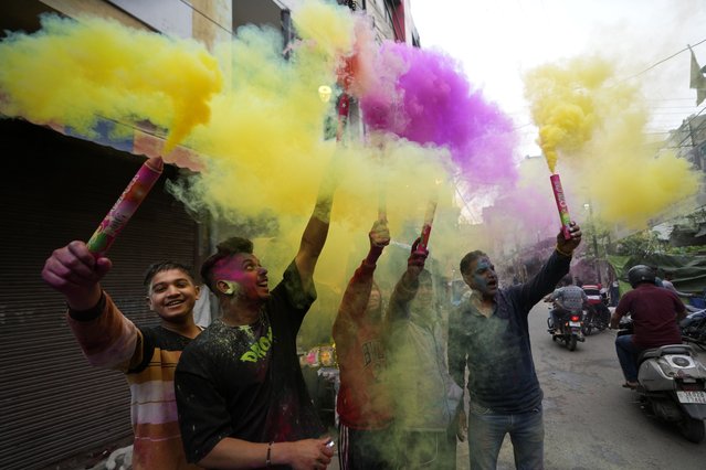 Indians play with colours as they celebrate Holi in Jammu, India, Friday, March 14, 2025. (Photo by Channi Anand/AP Photo)