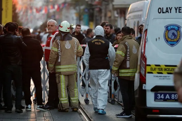 Police and emergency service members work at the scene after an explosion on busy pedestrian Istiklal street in Istanbul, Turkey on November 13, 2022. (Photo by Kemal Aslan/Reuters)