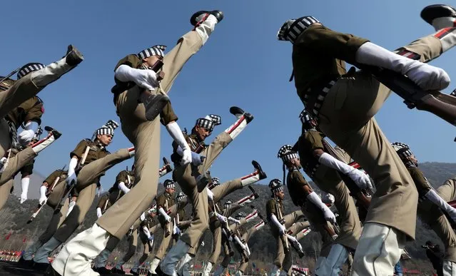 New recruits of Jammu and Kashmir policemen march during their passing out parade at a training centre in Sheeri, Baramulla, some 65 kilometers north of Srinagar, the summer capital of Indian Kashmir, 21 January 2018. At least 471 new police recruits completed their training course and are ready to discharge their professional duties. (Photo by Farooq Khan/EPA/EFE/Rex Features/Shutterstock)