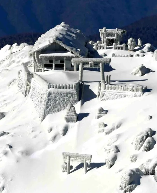 Mt. Ontake is covered with snow and the mountain lodges are frozen with ice on the peak, straddling Nagano and Gifu Prefectures on November  27, 2014, two months after the 3, 067 meter-high mountain erupted. The eruption was the nation's worst volcanic disaster since the end of the World War – in terms of casualities, with 57 people confirmed dead. The search for six missing people discontinued due to snowfall. (Photo by The Yomiuri Shimbun via AP Images)