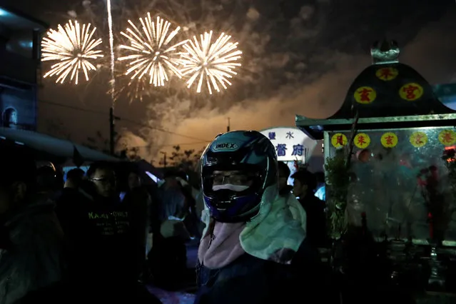 Fireworks light up the sky during the “Beehive Firecrackers” festival at the Yanshui district in Tainan, Taiwan on March 1, 2018. (Photo by Tyrone Siu/Reuters)