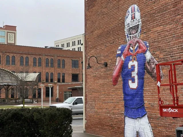 A mural by artist Adam Zyglis of Buffalo Bills player Damar Hamlin, who is recovering after going into cardiac arrest during a game Jan. 2, covers the outside of a building in Buffalo, N.Y., on Wednesday, January 18, 2023. (Photo by Carolyn Thompson/AP Photo)