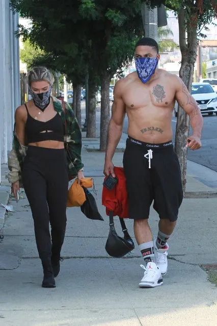American rapper Nelly and American dancer Daniella Karagach walk out of the DWTS studio in Los Angeles, CA. on Thursday October 22, 2020.  The rapper shows off his chiseled chest as he walks out shirtless. (Photo by Backgrid USA)