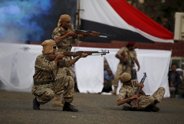 Houthi militants perform during a rally commemorating the 52nd anniversary of the start of South Yemen's uprising against British rule, in Sanaa October 14, 2015. (Photo by Khaled Abdullah/Reuters)