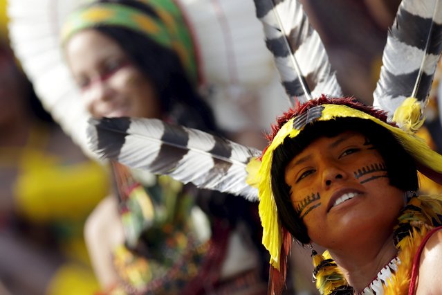 An indigenous woman from Kanela tribe poses for photos after participating in a parade of indigenous beauty during the first World Games for Indigenous Peoples in Palmas, Brazil, October 29, 2015. (Photo by Ueslei Marcelino/Reuters)