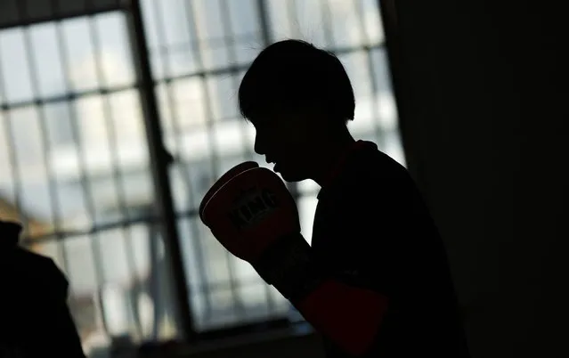 Vin Huang prepares for her boxing class at Princess Women's Boxing Club in Shanghai December 6, 2014. (Photo by Carlos Barria/Reuters)