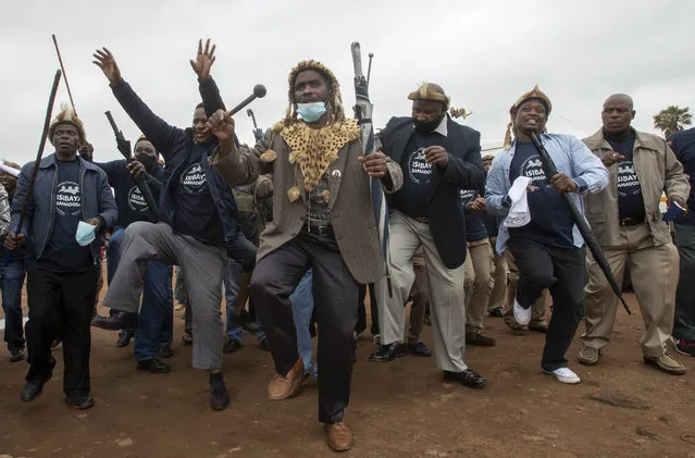 Zulu traditional men, sing and dance during a community and a local government campaign against Gender-Based Violence (GBV) and education on COVID-19, at a hostel in Katlehong, near Johannesburg, South Africa, Saturday, November 28, 2020. (Photo by Themba Hadebe/AP Photo)