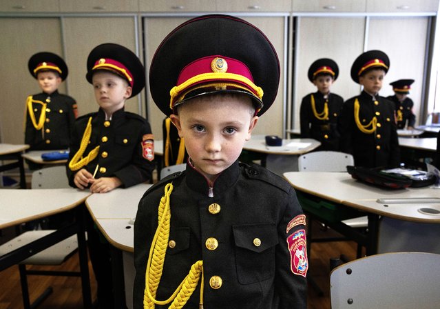 Student Kuzma Lavrenchuk, 6, ( center) wears the cadet uniform in the first grade at the Kyiv Cadet Corps Volodymyr Velykii school #23 on September 12, 2025 in Kyiv, Ukraine. President Volodymyr Zelensky approved amendments to the law on military duty and service, the revision stipulates basic military training for higher education students starting this month. (Photo by Paula Bronstein /Getty Images)
