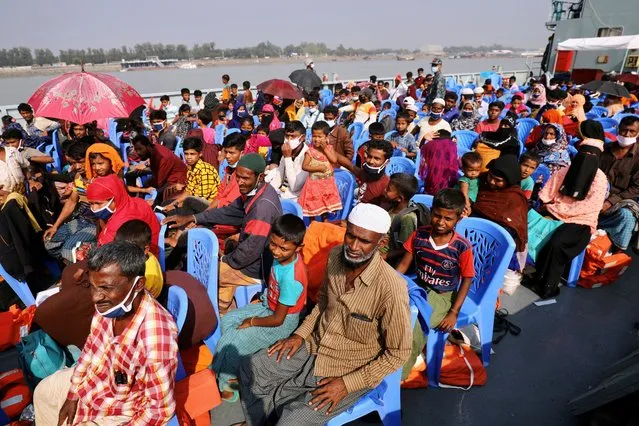 Rohingyas are seen onboard a ship as they are moving to Bhasan Char island in Chattogram, Bangladesh, December 4, 2020. (Photo by Mohammad Ponir Hossain/Reuters)