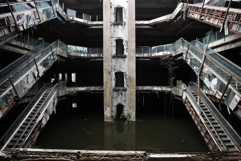 Fishing in the Flooded Ground Floor of an Abandoned Department Store in Bangkok