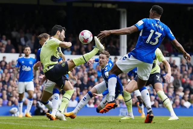 Manchester City's Ilkay Gundogan, center left, scores his side's opening goal during the English Premier League soccer match between Everton and Manchester City at the Goodison Park stadium in Liverpool, England, Sunday, May 14, 2023. (Photo by Jon Super/AP Photo)