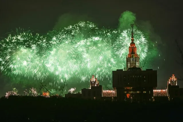 Fireworks explode over the historical building of the Moscow State University on the Vorobyovy Gory (the Sparrow Hills) during Victory Day, the 78th anniversary of the end of World War II in Europe, in Moscow, Russia, Tuesday, May 9, 2023. (Photo by Alexander Zemlianichenko/AP Photo)