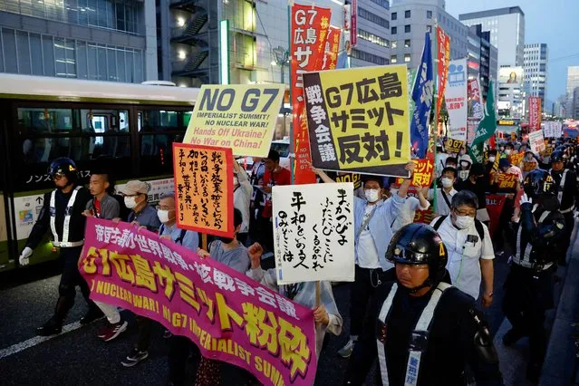 Anti-G7 protesters walk through the city, ahead of the G7 summit, in Hiroshima, Japan, May 17, 2023. (Photo by Androniki Christodoulou/Reuters)