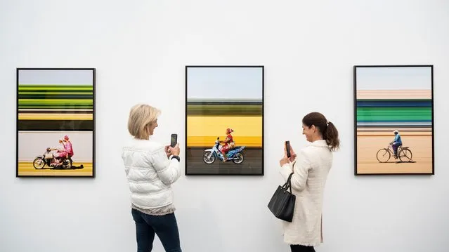 Visitors view works by Girma Berta, Nil Gallery Paris, at a preview of Photo London on May 10, 2023. The annual photography fair at Somerset House celebrates photography from the vintage to modern alongside a selection of the world?s leading photography dealers and galleries. A public programme of talks, tours and more run throughout the show 11 to 14 May 2023. (Photo by Stephen Chung/Alamy Live News)