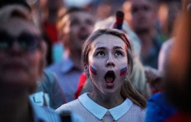 A Russian fan reacts as she watches a screening of the Russia 2018 World Cup Group A football match between Russia and Egypt, at the Fan Zone in Nizhny Novgorod on June 19, 2018. (Photo by Johannes Eisele/AFP Photo)