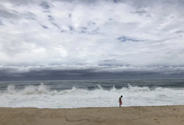 In this Wednesday, June 13, 2018 photo, waves crash on the beach in San Jose del Cabo, Mexico. Tropical Storm Bud lashed the southern end of Mexico's Baja California Peninsula, home to the popular beach resorts of Los Cabos, with heavy winds Thursday as locals and tourists braced for an expected landfall later in the day. (Photo by Juliet Williams/AP Photo)