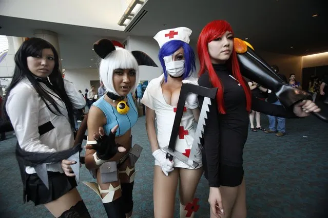 Attendees dressed as characters from the video game Skullgirls pose during Comic-Con international convention in San Diego, California July 13, 2012. (Photo by Mario Anzuoni/Reuters)