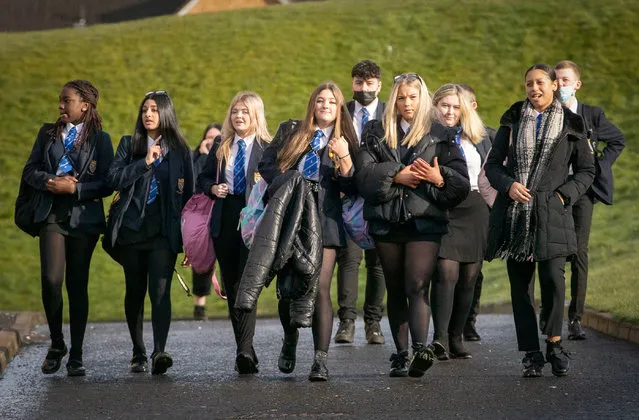 Students arrive at St Andrew's RC Secondary School in Glasgow on Monday, March 15, 2021, as more pupils are returning to school in Scotland in the latest phase of lockdown easing. (Photo by Jane Barlow/PA Images via Getty Images)