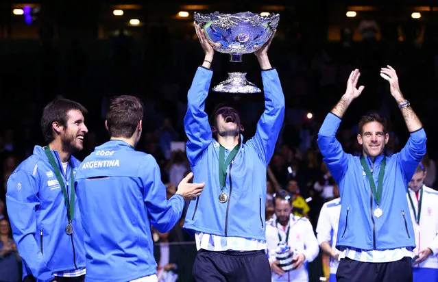 Argentina's Federico Delbonis lifts the trophy after winning the Davis Cup final in Zagreb, Croatia, Sunday, November 27, 2016. Argentina defeated Croatia 3-2 in the Davis. (Photo by Antonio Bronic/Reuters)