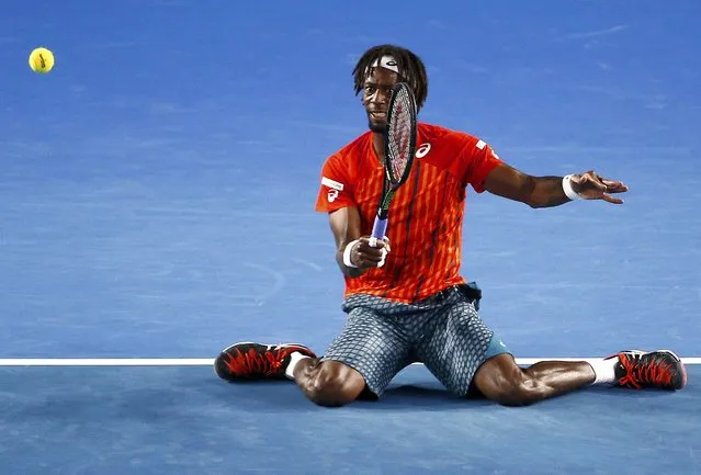 France's Gael Monfils hits a shot on his knees during his quarter-final match against Canada's Milos Raonic at the Australian Open tennis tournament at Melbourne Park, Australia, January 27, 2016. (Photo by Jason O'Brien/Reuters/Action Images)