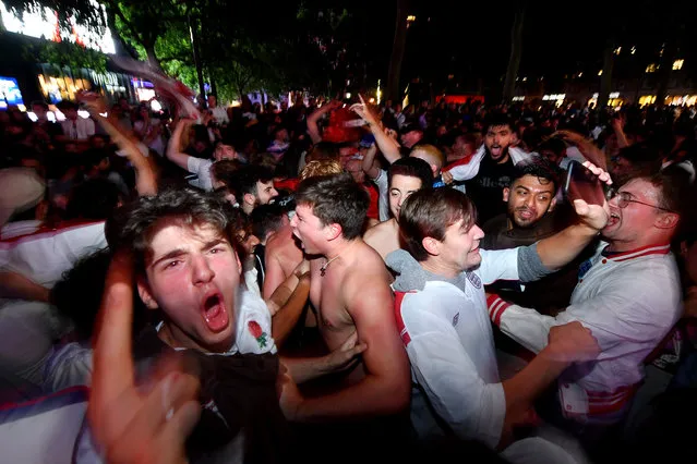 England supporters celebrate victory in Leicester Square, London, United Kingdom on July 7, 2021. (Photo by James Veysey/Rex Features/Shutterstock)