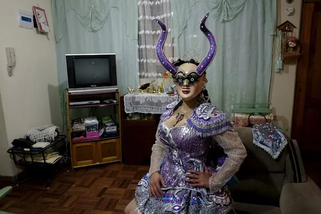 Alicia Vargas, 23, a performer from the Urus Diablada group, poses with her costume before a practice ahead of Carnival in Oruro, Bolivia February 5, 2016. (Photo by David Mercado/Reuters)