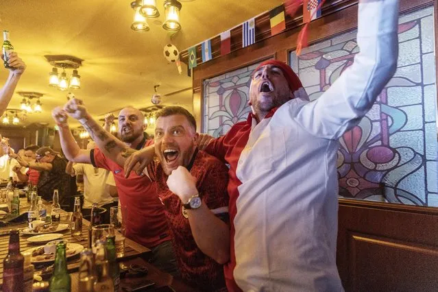 Beer sales have been banned at stadiums hosting World Cup matches but England fans have been able to enjoy a traditional pub atmosphere and a drink at the Red Lion in Doha on November 25, 2022. (Photo by Jack Hill/The Times)