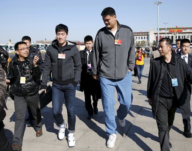 Former NBA player Yao Ming (R) and Chinese hurdler Liu Xiang, delegates of the Chinese People's Political Consultative Conference (CPPCC), arrive at the Great Hall of the People to attend the third plenary meeting of CPPCC at the Great Hall of the People in Beijing, in this March 11, 2015 file photo. (Photo by Kim Kyung-Hoon/Reuters)