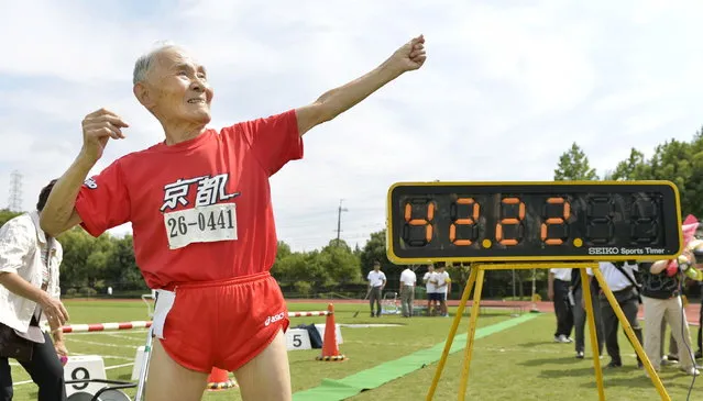 105-year-old Japanese Hidekichi Miyazaki poses like Jamaica's Usain Bolt in front of an electric board showing his 100-metre record time of 42.22 seconds at an athletic field in Kyoto, Japan, in this photo taken by Kyodo September 23, 2015. Japanese centenarian Hidekichi Miyazaki set a record as the world's oldest competitive sprinter this week, one day after turning 105, but said he was disappointed at falling short of his own personal best. (Photo by Reuters/Kyodo News)