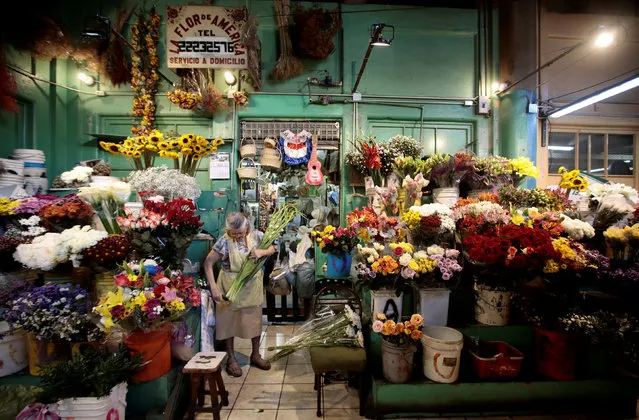 A woman sells flowers in the Central Market in San Jose, Costa Rica March 13, 2019. (Photo by Juan Carlos Ulate/Reuters)