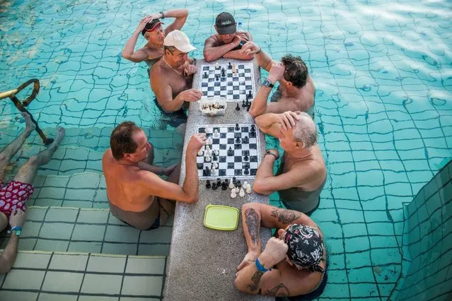Visitors play chess in a pool of the Szechenyi Thermal Bath and Swimming Pool in Budapest, Hungary, 21 March 2016 (issued 22 March 2016), the day before World Water Day. Since Roman times many inland and foreign visitors have come to enjoy the benefits of the curative properties of the country’s abundant mineral-rich natural hydrothermal waters that upstream from the ground from a network of geothermal reserves present in the Carpathian Basin. (Photo by Zoltan Balogh/EPA)