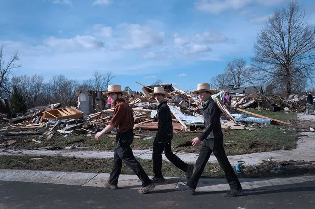 Residents clean up after a tornado ripped through town on March 15, 2024 in Winchester, Indiana.  At least three people have been reported killed after a series of tornadoes ripped through the midwest yesterday. (Photo by Scott Olson/Getty Images)