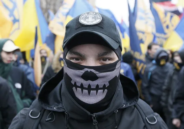 Activists of nationalist groups and their supporters take part in the so-called March of Dignity, marking the third anniversary of the 2014 Ukrainian pro-European Union (EU) mass protests, in Kiev, Ukraine, February 22, 2017. (Photo by Valentyn Ogirenko/Reuters)