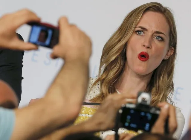 Journalists take pictures of cast member Emily Blunt as she arrives to attend a news conference for the film “Sicario” in competition at the 68th Cannes Film Festival in Cannes, southern France, May 19, 2015. (Photo by Regis Duvignau/Reuters)