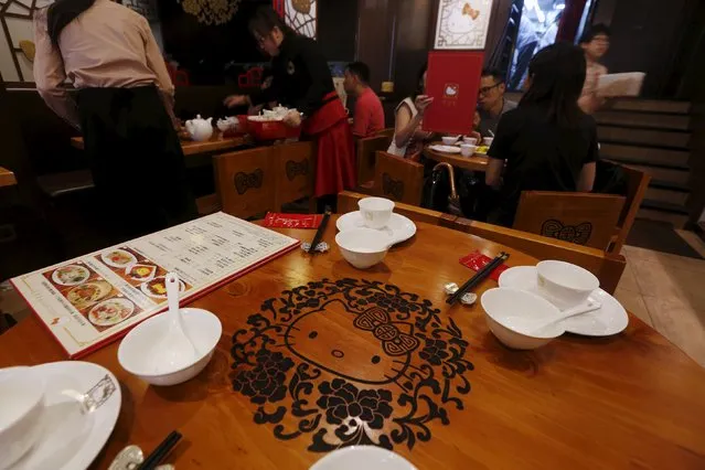 A Hello Kitty image is carved on a table in a Hello Kitty-themed Chinese restaurant in Hong Kong, China May 21, 2015. (Photo by Bobby Yip/Reuters)