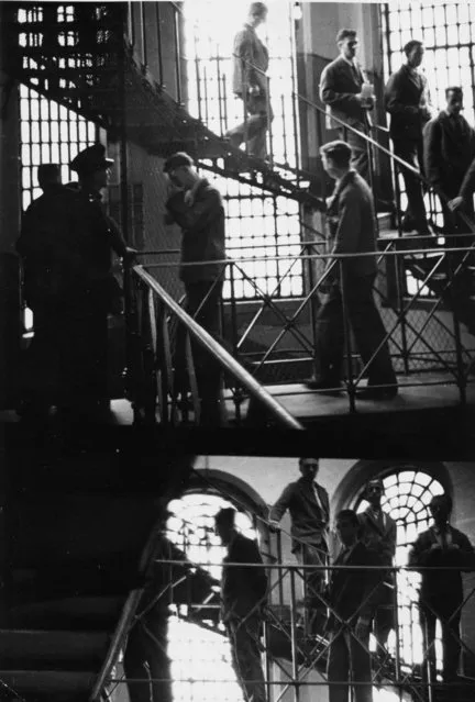 Prison officers watch over prisoners at Strangeways Prison in Manchester, England, 20th November 1948. (Photo by Bert Hardy/Picture Post/Getty Images)