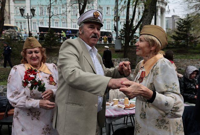 People take part in the celebrations of Victory Day in Vladivostok, Russia, on May 9, 2024. (Photo by Tatiana Meel/Reuters)