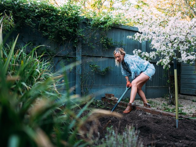 Blonde female adult gardening at home. (Photo by Matt Porteous/Getty Images)