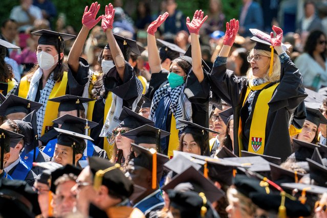 Graduates protest the conflict between Israel and the Palestinian Islamist group Hamas, during the commencement at Yale University, New Haven, Connecticut, U.S., May 20, 2024. (Photo by Michelle McLoughlin/Reuters)